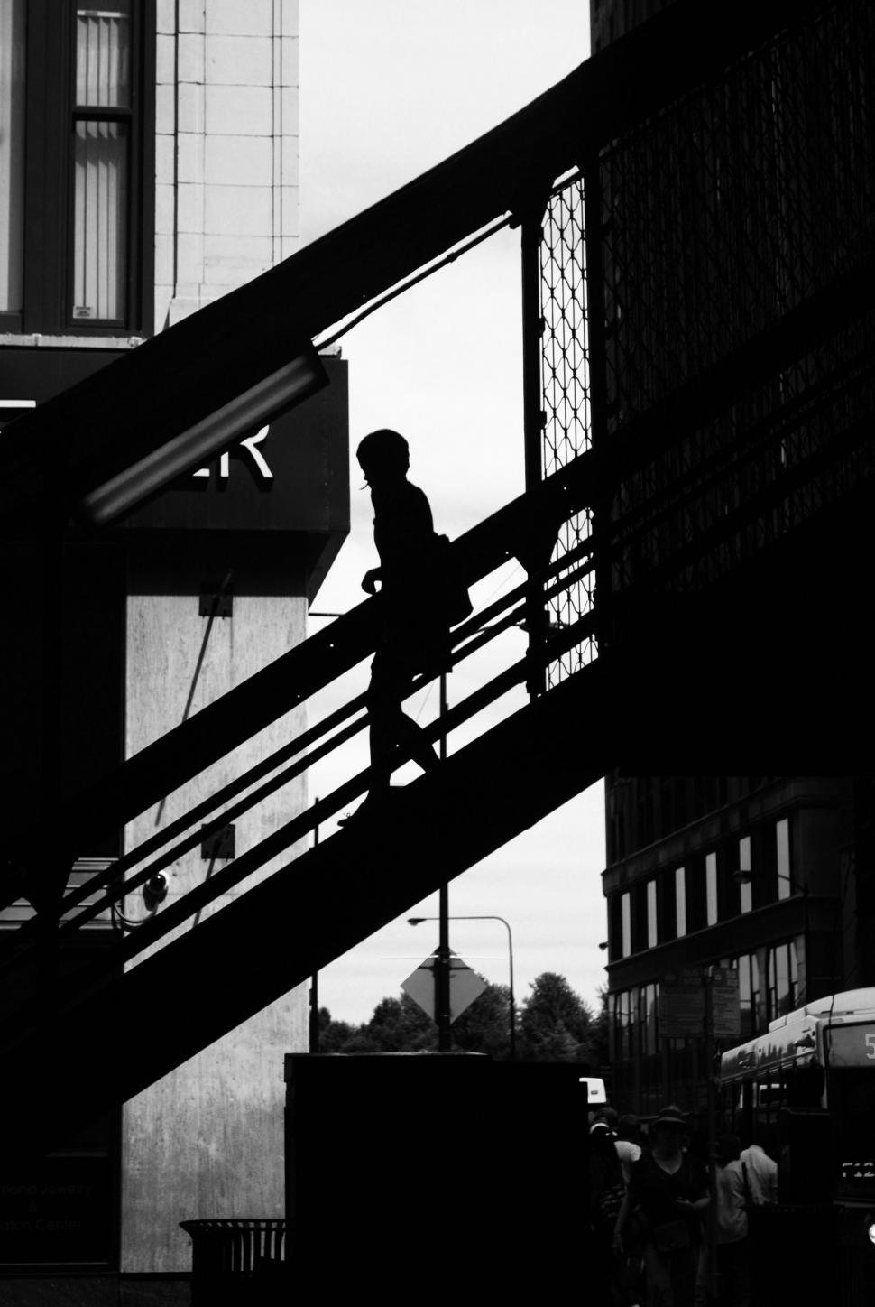 Free Image of Person Walking Up a Set of Stairs 