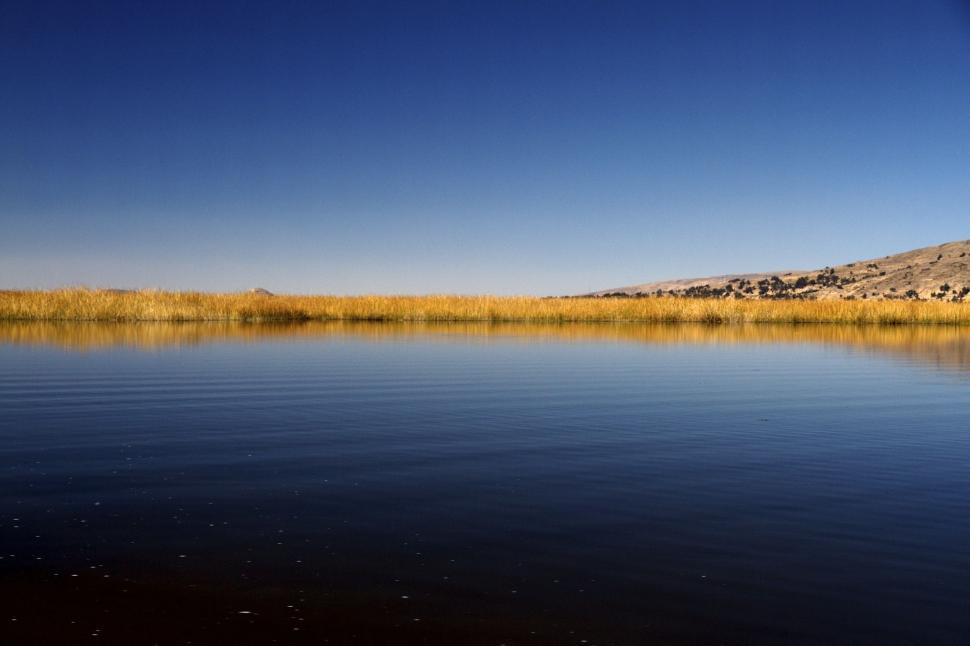 Free Image of Water Body With Hill in Background 