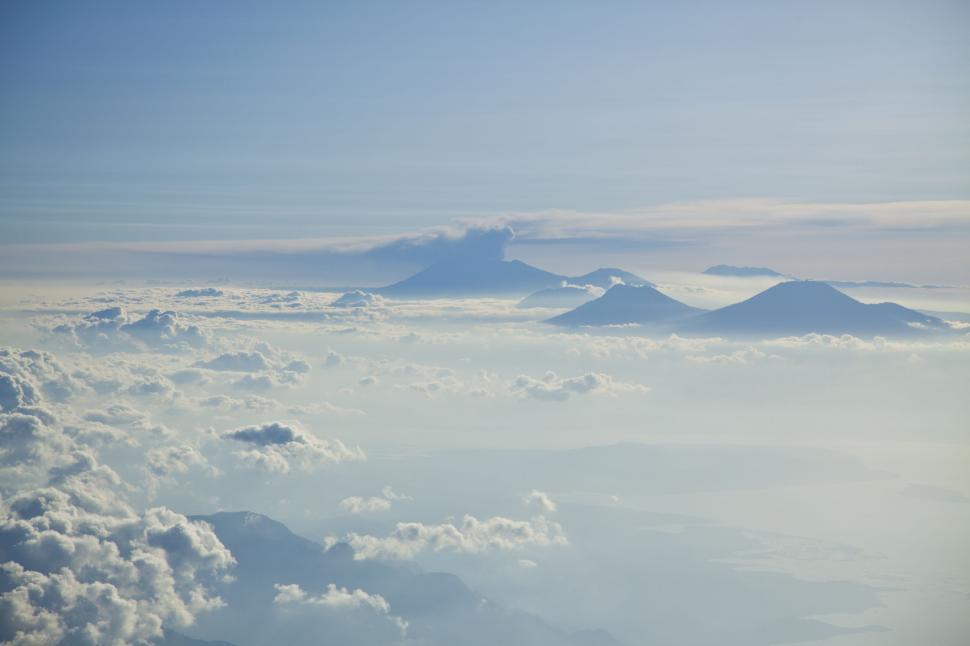 Free Image of Stunning View of Clouds and Mountains From Airplane 