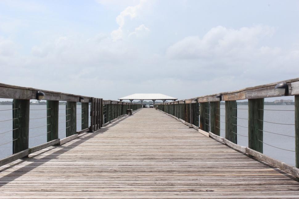 Free Image of Wooden Pier With White Umbrella 