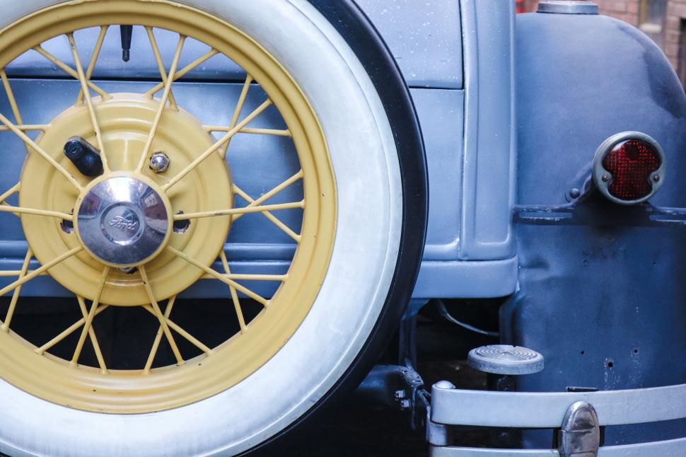 Free Image of Close Up of Front Wheel of Vintage Car 