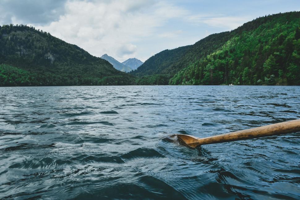 Free Image of Wooden Pole Floating in Middle of Lake 