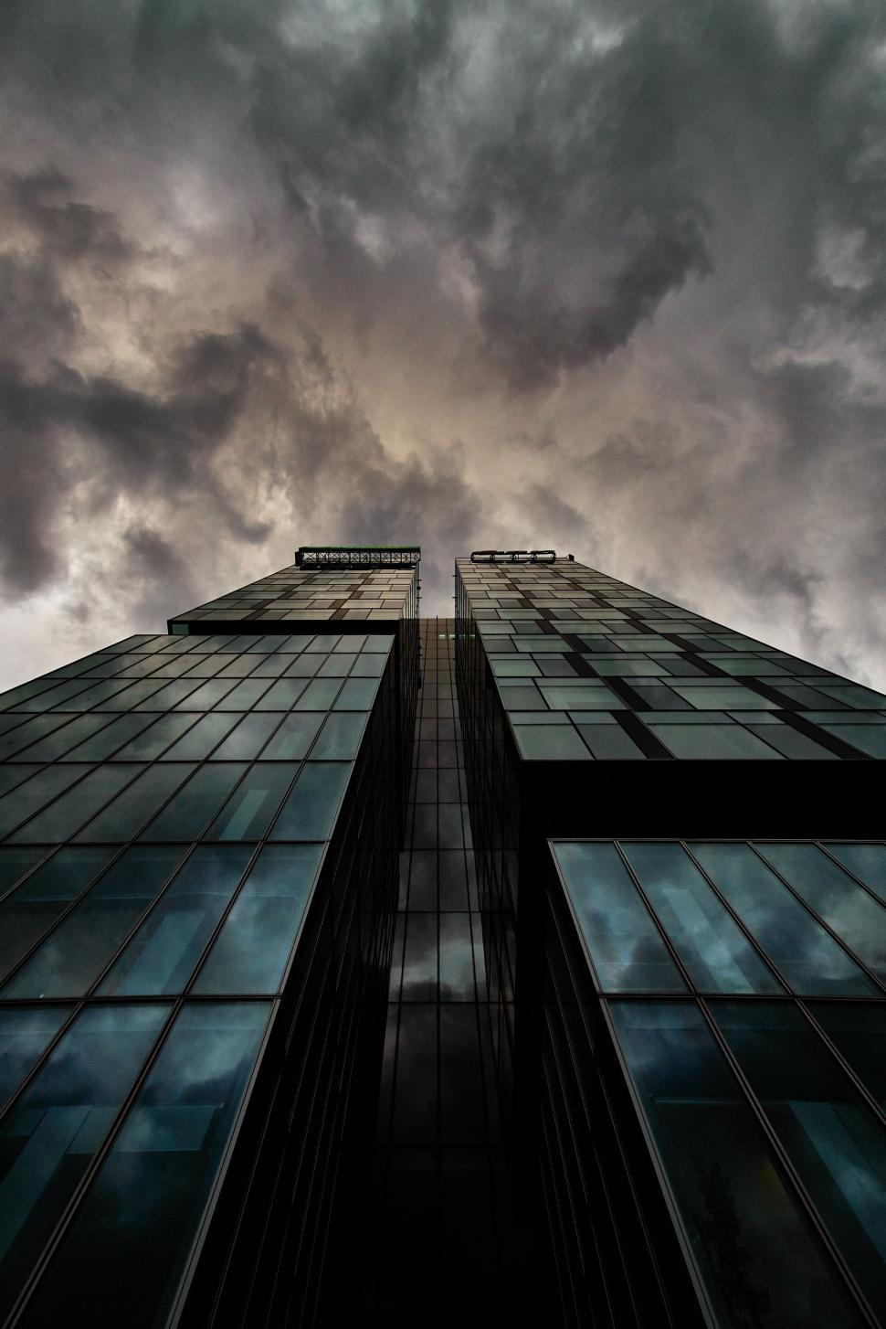 Free Image of Tall Building Against Cloudy Sky 