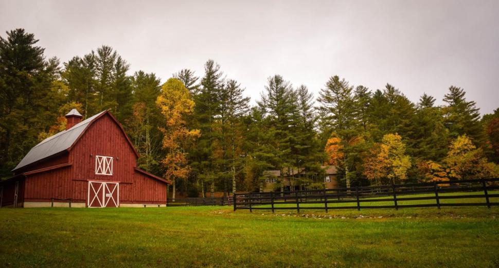 Free Image of Red Barn Standing in the Middle of a Field 