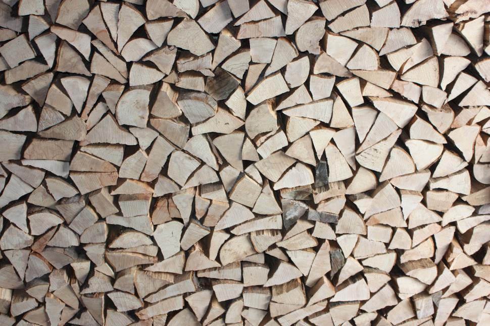 Free Image of Large Pile of Wood on Wooden Floor 