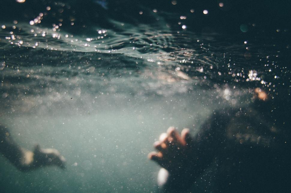 Free Image of Person Swimming With Hand Underwater 