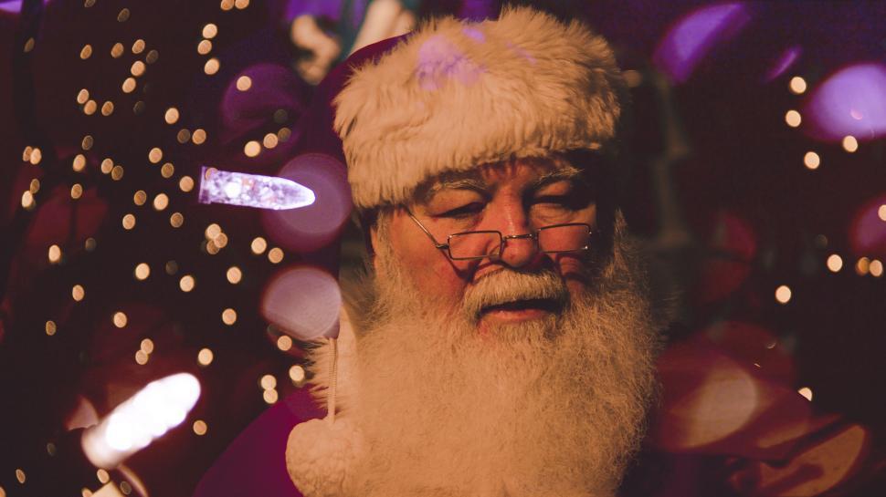 Free Image of Man With Beard and Glasses Wearing Santa Hat 