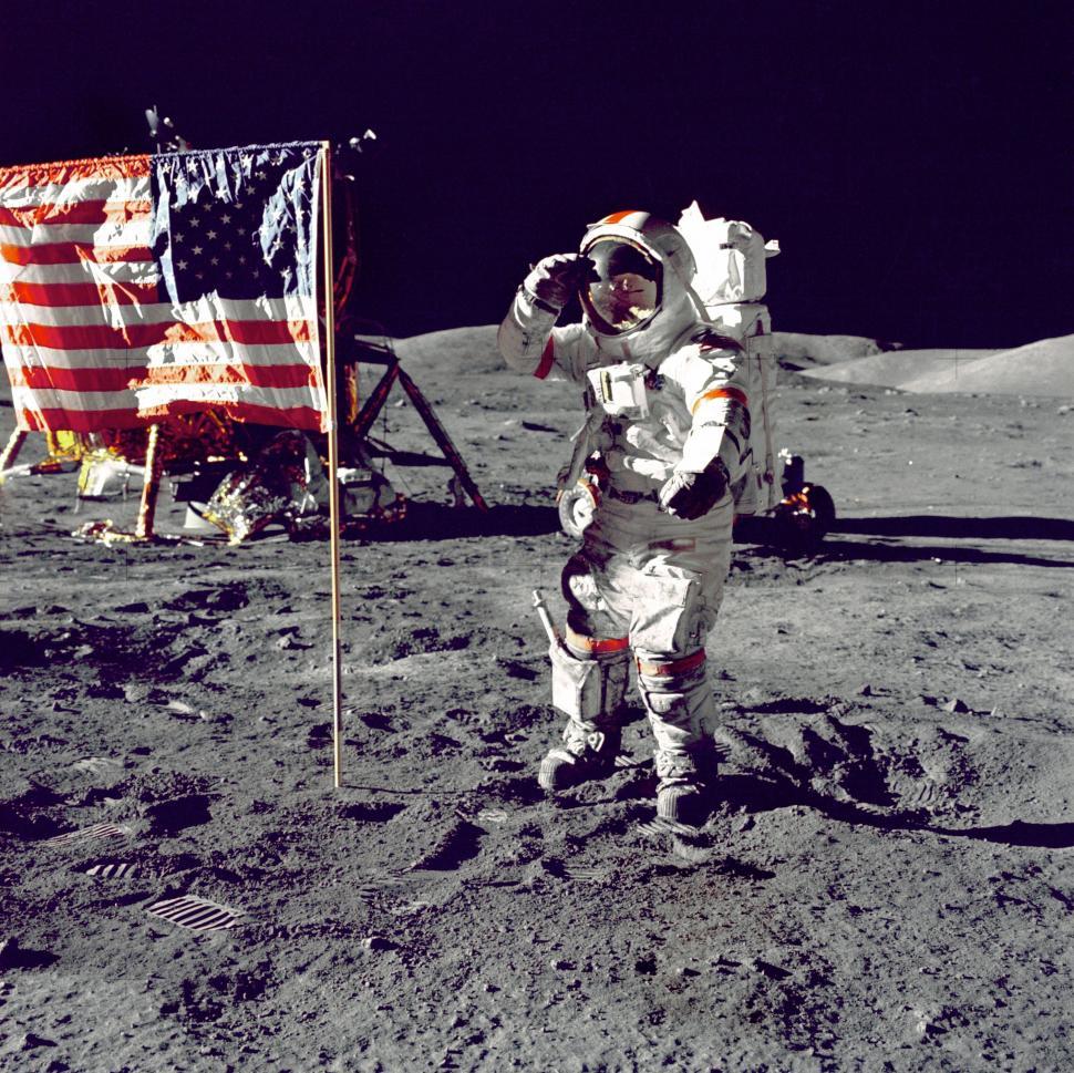 Free Image of Astronaut Standing on the Moon Next to American Flag 