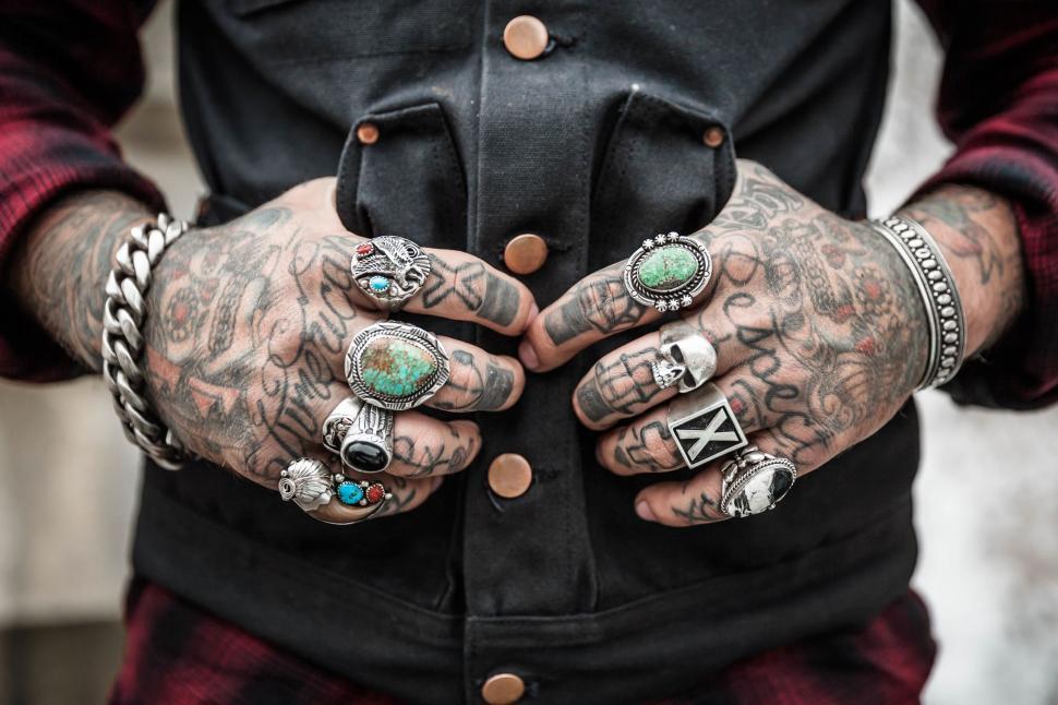 Free Image of Man Adorned With Multiple Rings on Fingers 
