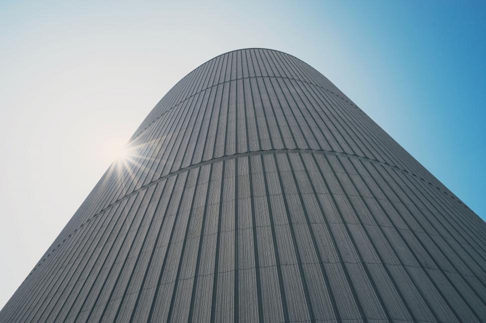 Free Image of Tall Building Top With Blue Sky Background 