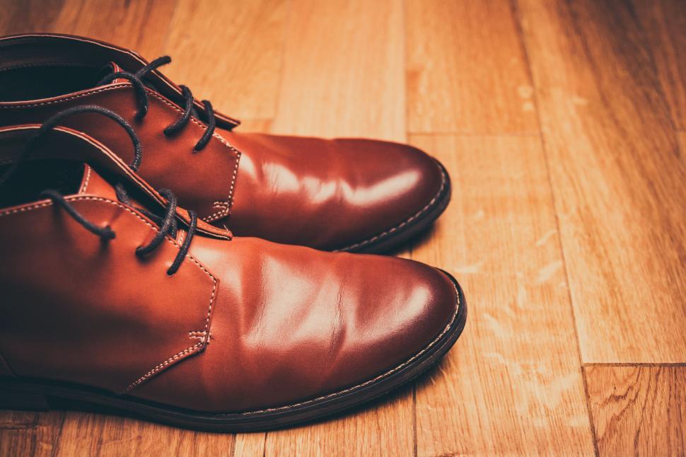 Free Image of Brown Shoes on Wooden Floor 