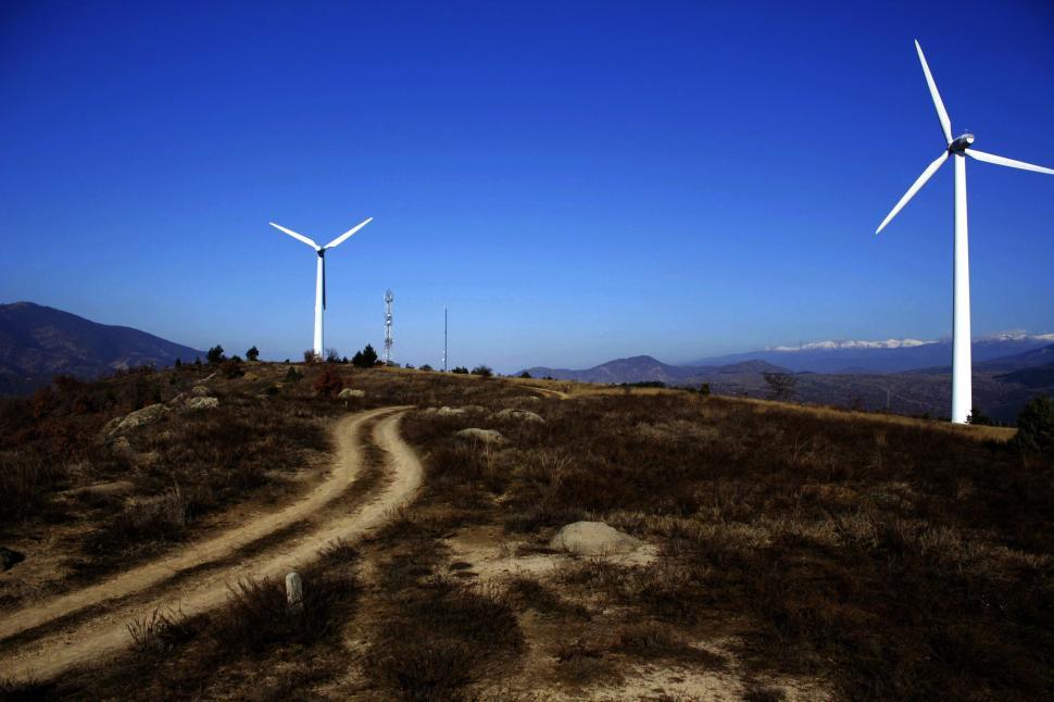 Free Image of Three Wind Turbines on a Hill With a Dirt Road 