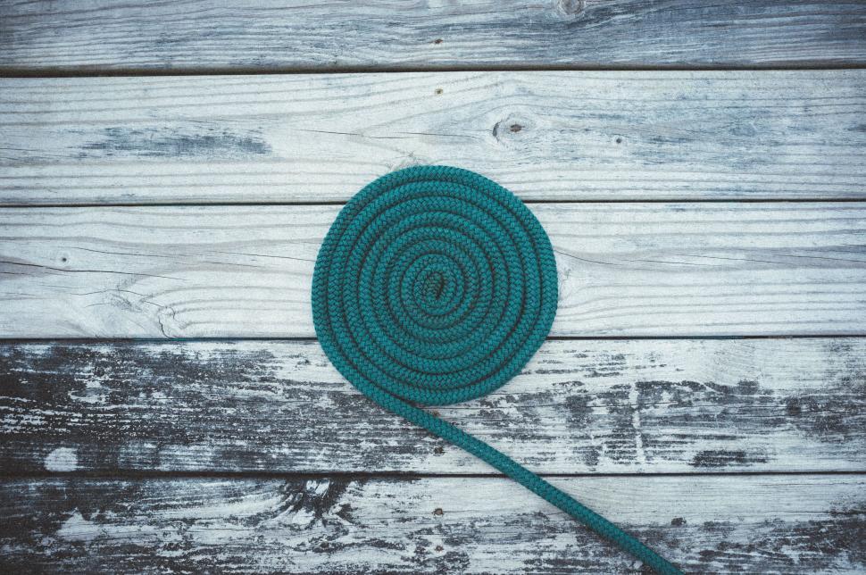 Free Image of Green Rope on Wooden Surface 