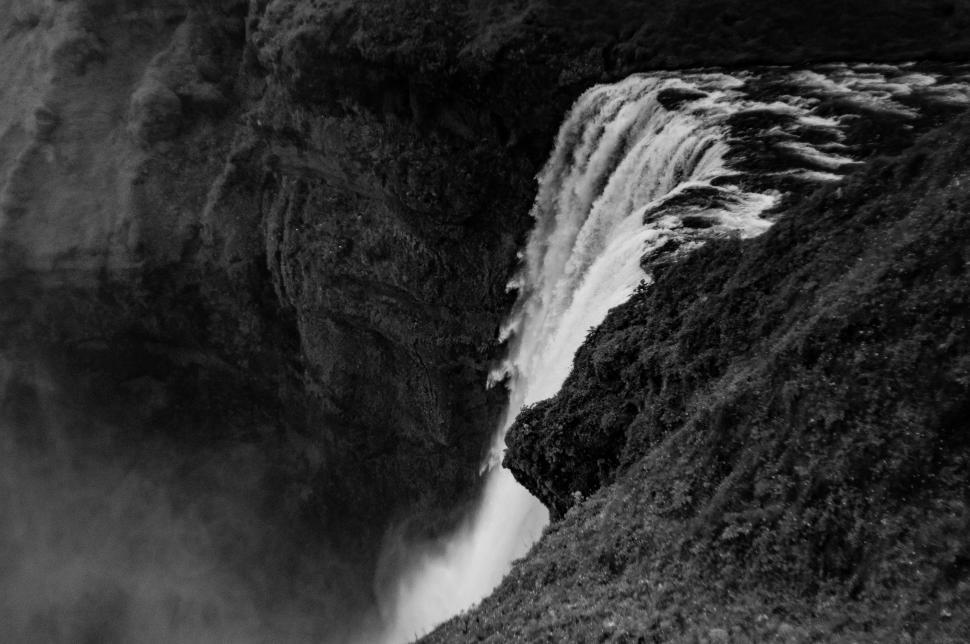 Free Image of Majestic Waterfall Cascading Down a Cliff 