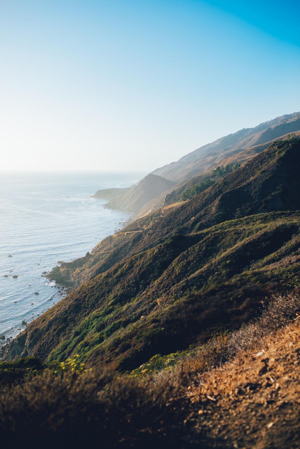Free Image of Panoramic View of the Ocean From a Hill 
