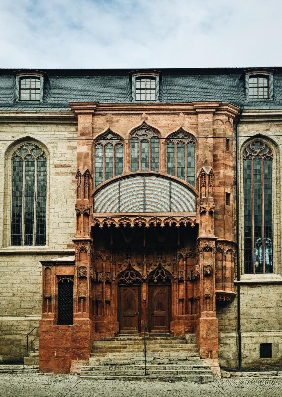 Free Image of Historic Building With Large Wooden Door 