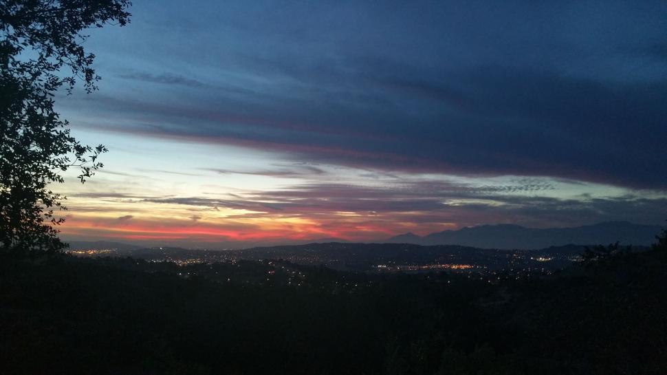 Free Image of A View of a Sunset From a Hill Top 