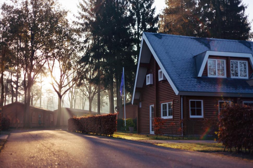 Free Image of House With Blue Roof and Driveway 