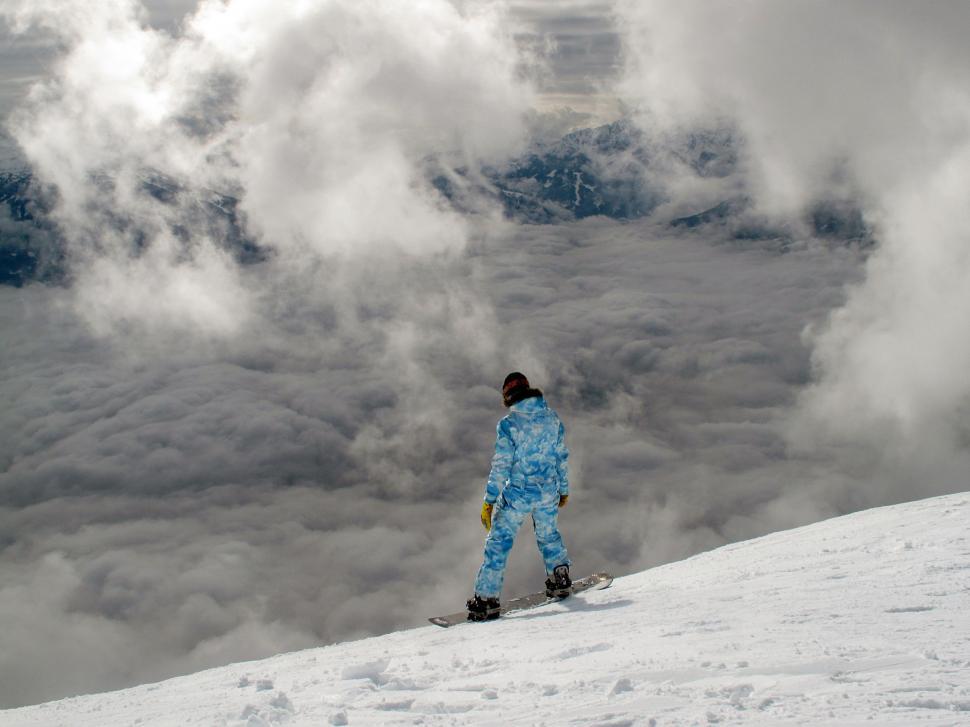 Free Image of Person on Skis Standing on Snowy Hill 
