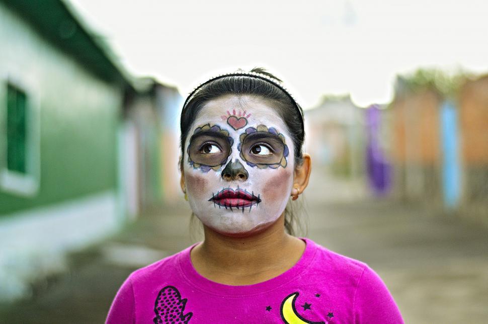Free Image of Young Girl With Skeleton Face Paint 