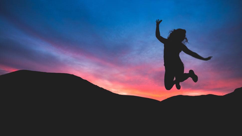 Free Image of Person Jumping in the Air at Sunset 