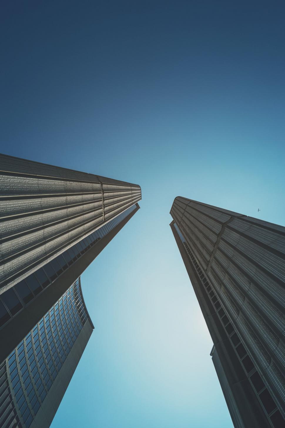 Free Image of Looking up at Two Tall Buildings 