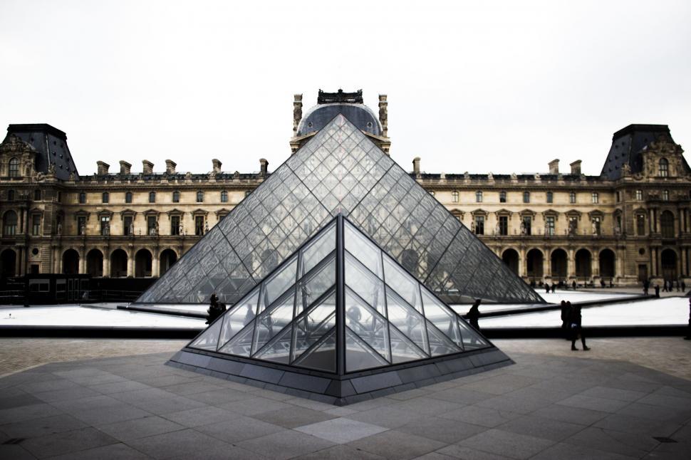 Free Image of Pyramid Shaped Building in Front of Large Structure 