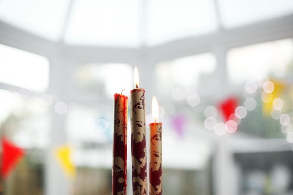 Free Image of Close Up of Three Candles on a Table 