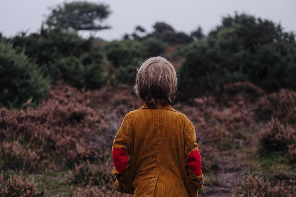 Free Image of Little Boy Standing in the Grass 