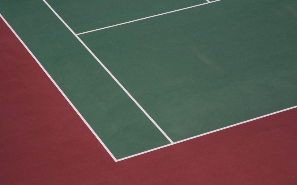 Free Image of Aerial View of Tennis Court With Red Floor 