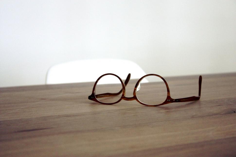 Free Image of Glasses Resting on Wooden Table 