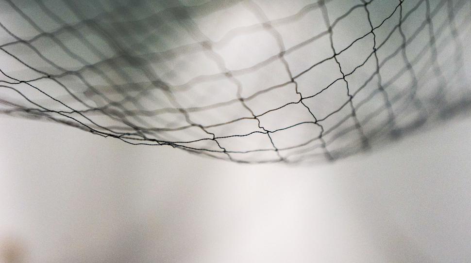 Free Image of A Mesh of Black and White Netting 