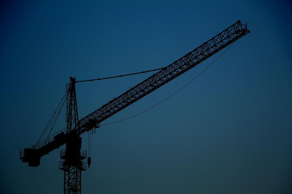 Free Image of Silhouette of Crane Against Blue Sky 
