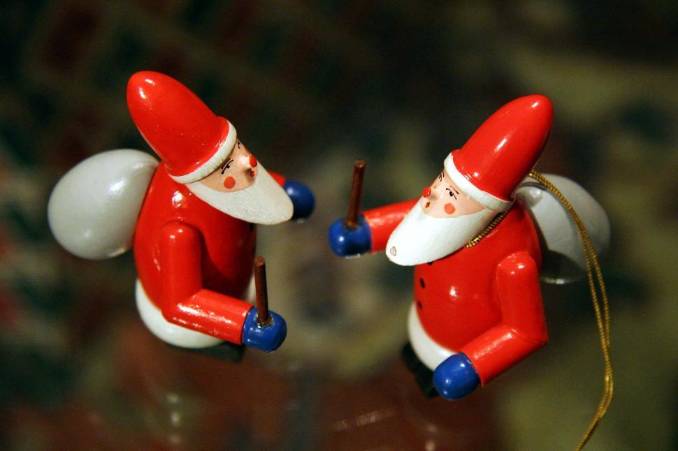 Free Image of A Couple of Red and White Santa Claus Ornaments 