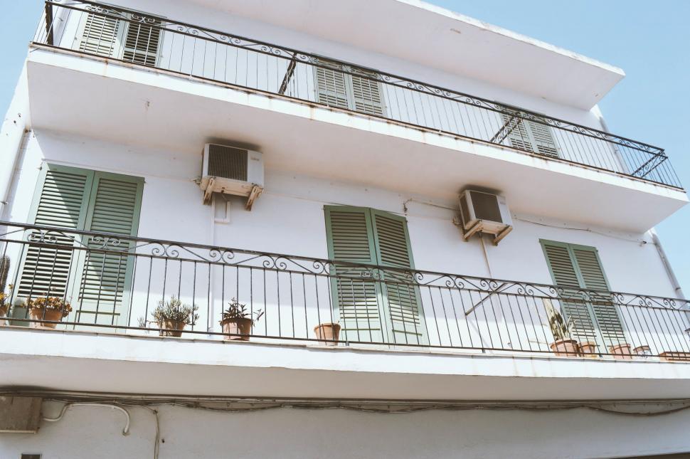 Free Image of White Building With Windows and Balconies 
