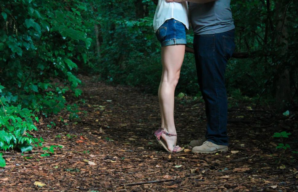 Free Image of Man and Woman Kissing in the Woods 