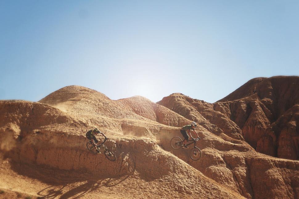 Free Image of Mountain Bikers Riding Through the Desert 