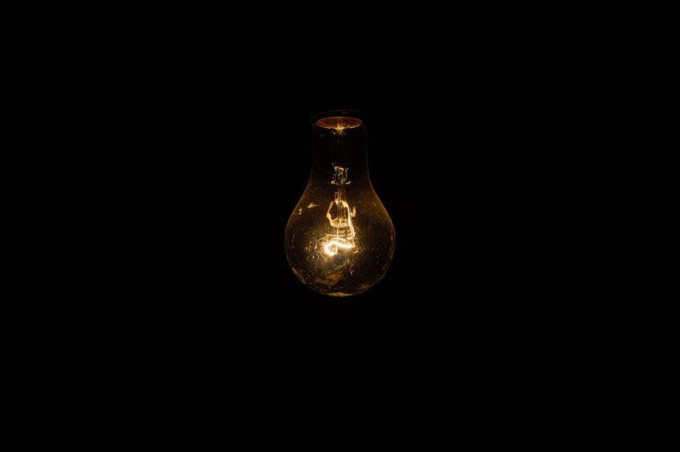 Free Image of Illuminated Light Bulb in Darkness 