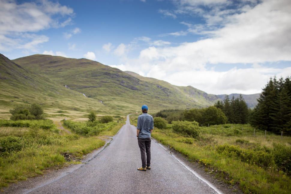 Free Image of Man Standing Next to Road 