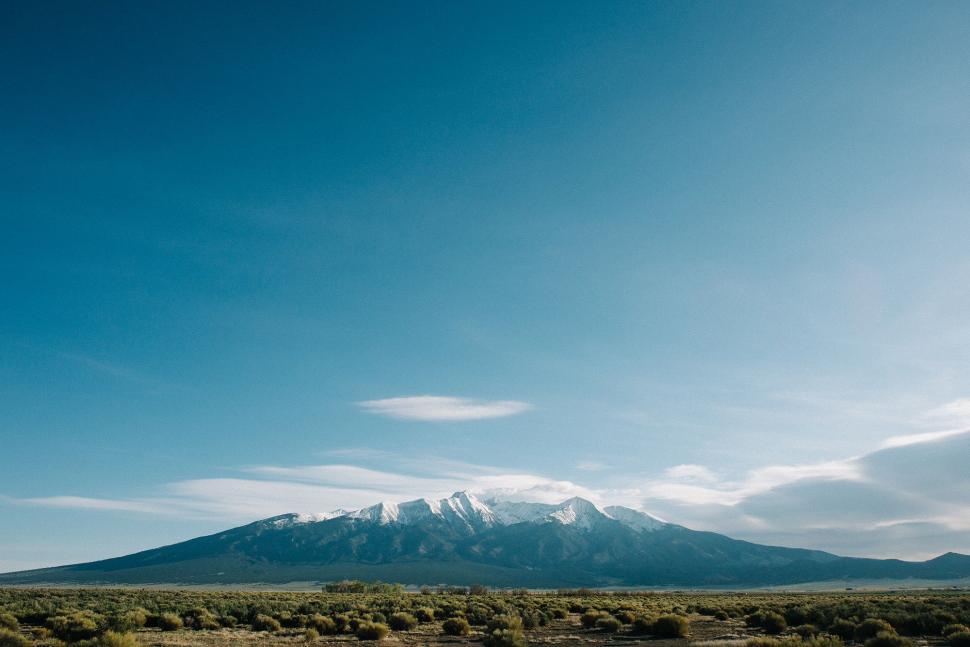 Free Image of Field With a Mountain in the Background 