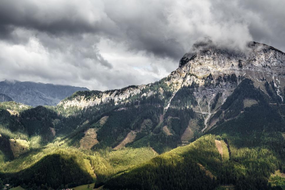 Free Image of Majestic Mountain Range Under Cloudy Sky 