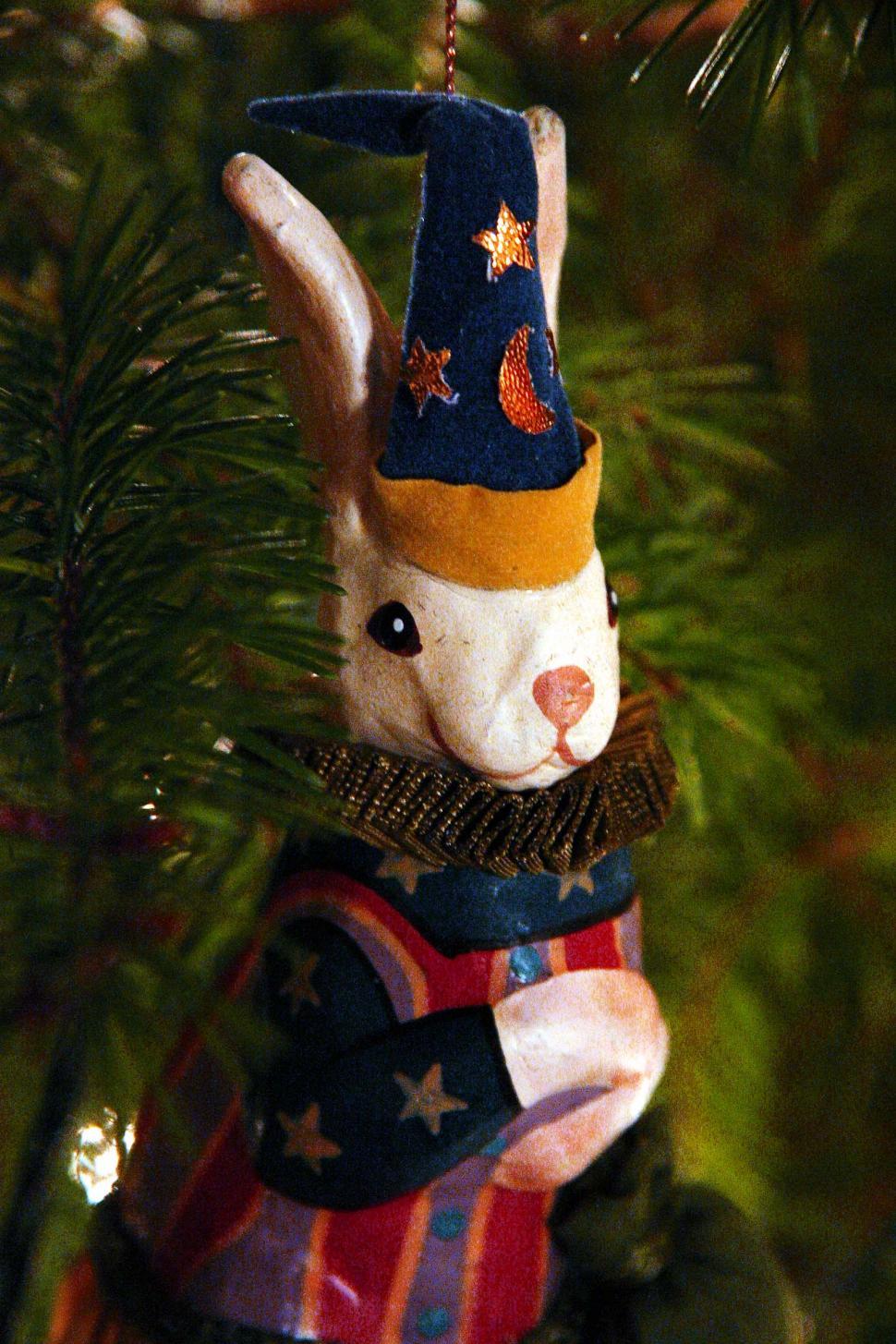 Free Image of Rabbit Ornament Hanging From a Christmas Tree 