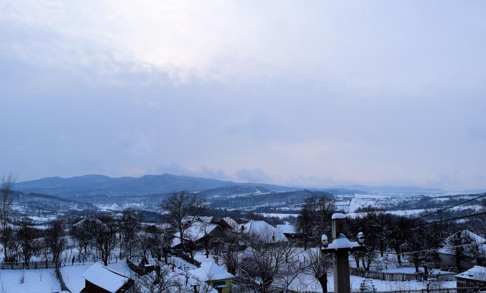 Free Image of Small rural village buildings in the middle of the winter under heavy snow  