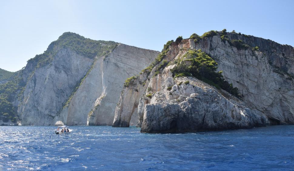 Free Image of Rocky shoreline with boats, Mediterranean Sea in Greece  