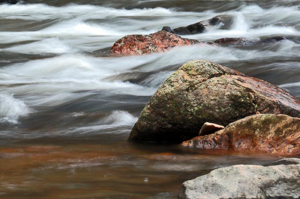 Free Image of Rushing Water Cascading Over Boulder Rocks 