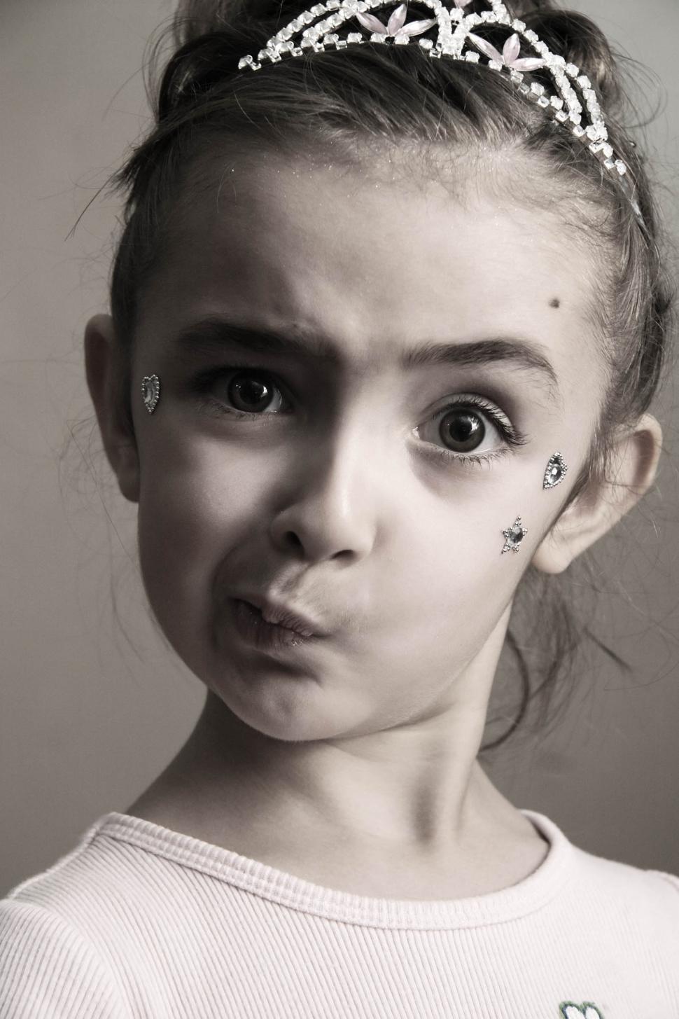 Free Image of Puzzled little girl princess 
