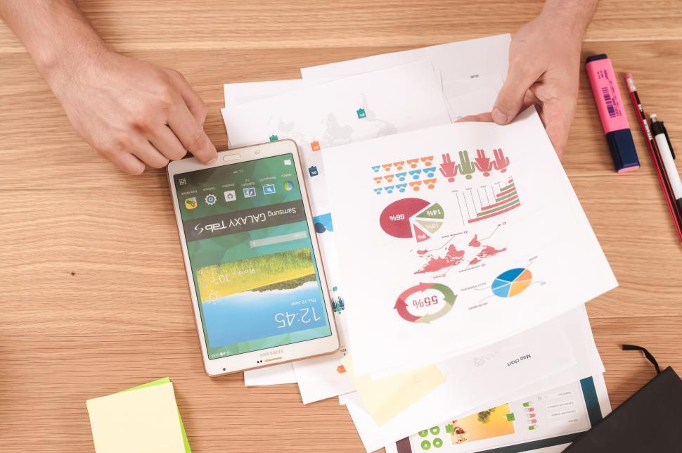 Download Free Stock Photo of Charts and infographics on desk 