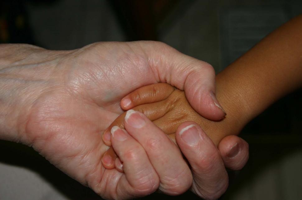 Free Image of Close Up of Two People Holding Hands 