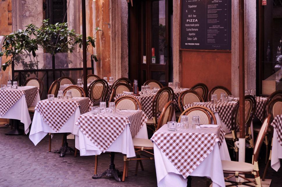 Free Image of Row of Tables With Checkered Cloths 