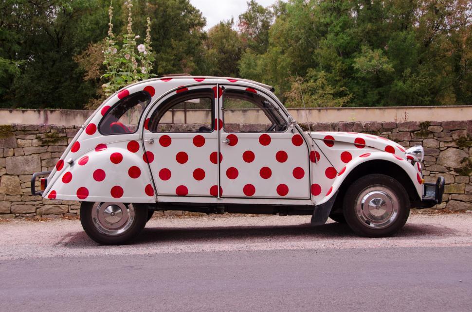 Free Image of Polka Dot Car Parked on Side of Road 